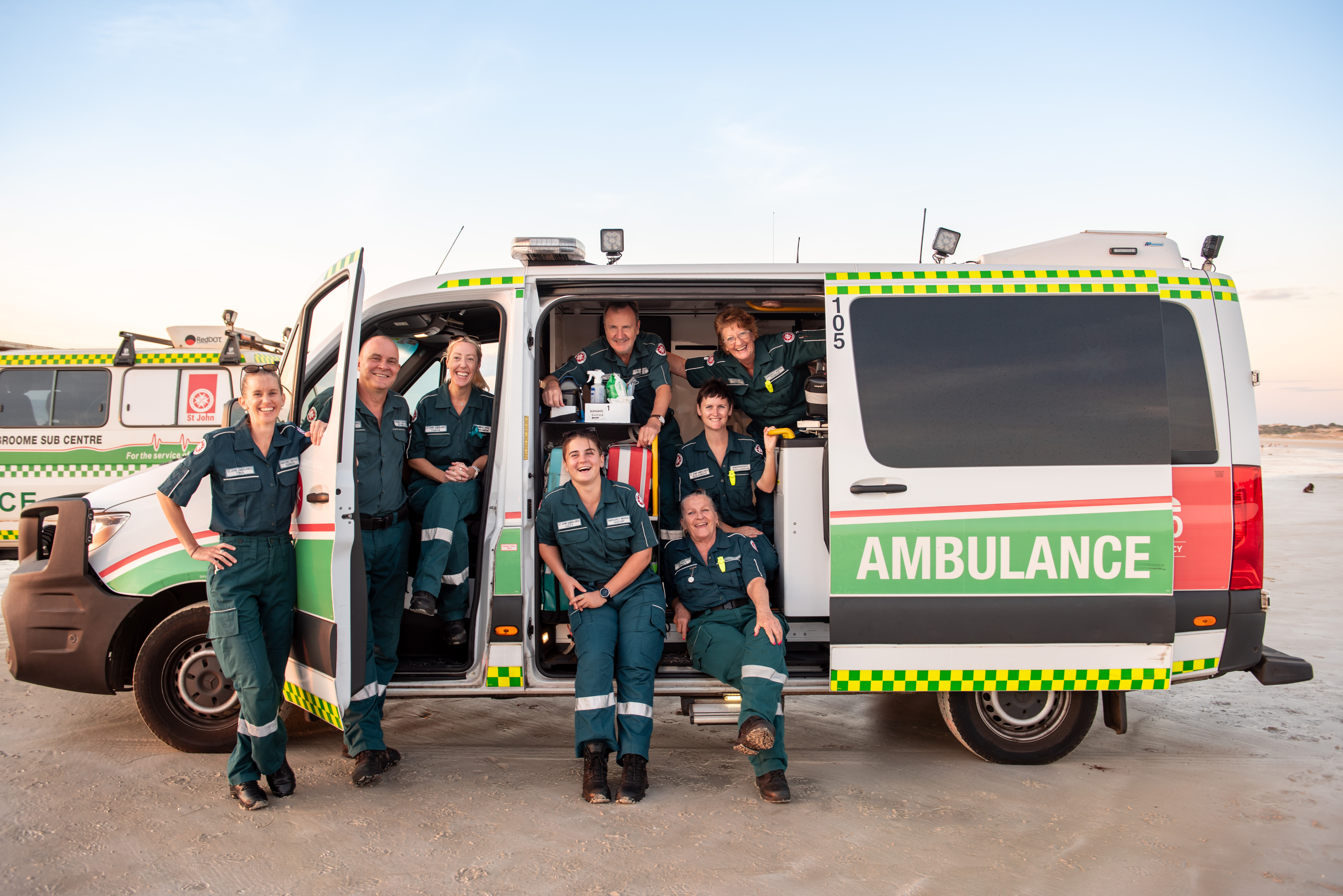 Volunteer Ambulance Officers inside and outside an ambulance