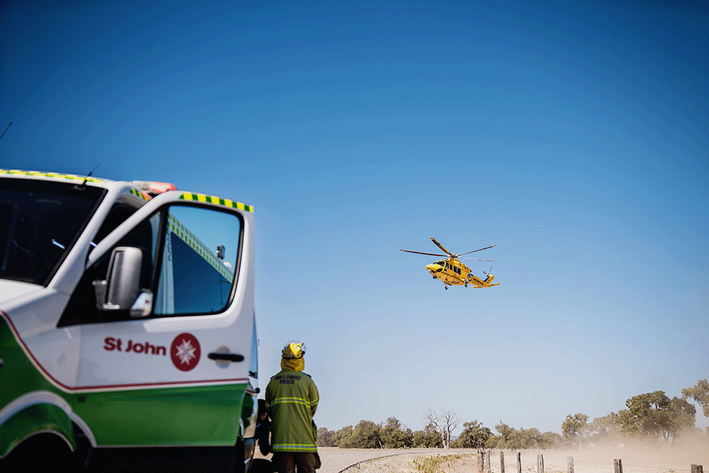 st john vehicle with helicopter in background